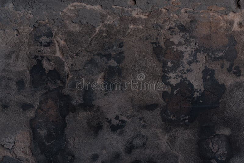 Full frame view of black cracked wall textured background stock photos