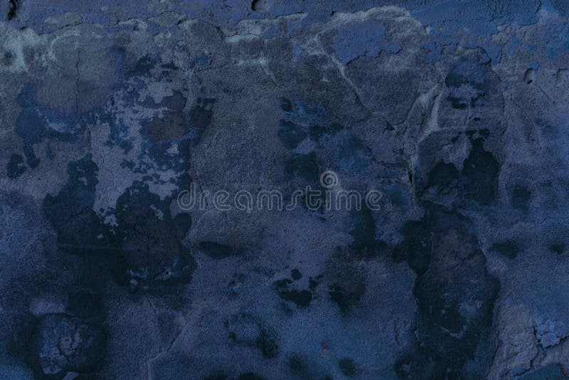 Full frame view of dark blue cracked wall textured background stock images