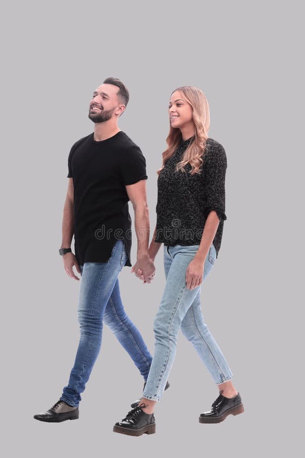 In full growth. young couple walking together stock photo