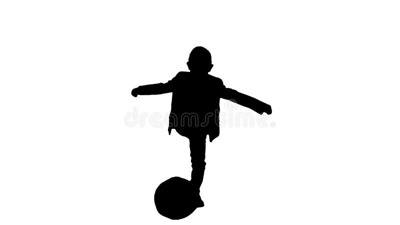 Silhouette Little Boy In Costume Shooting at Goal.