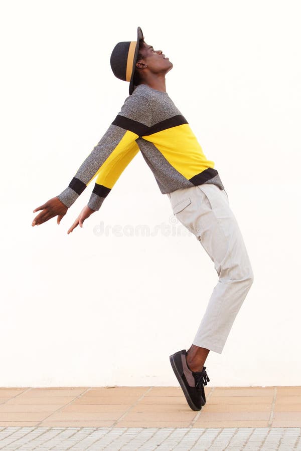 Full Length African Male Dancer Standing on His Tip Toes Making a Cool ...
