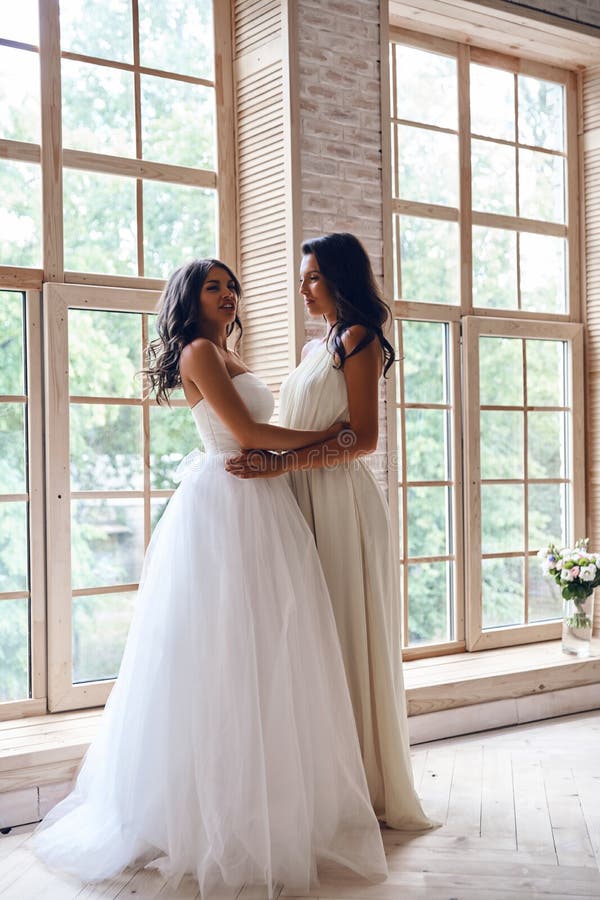 Charming Bride. Full Length of Attractive Young Women Wearing a Stock ...