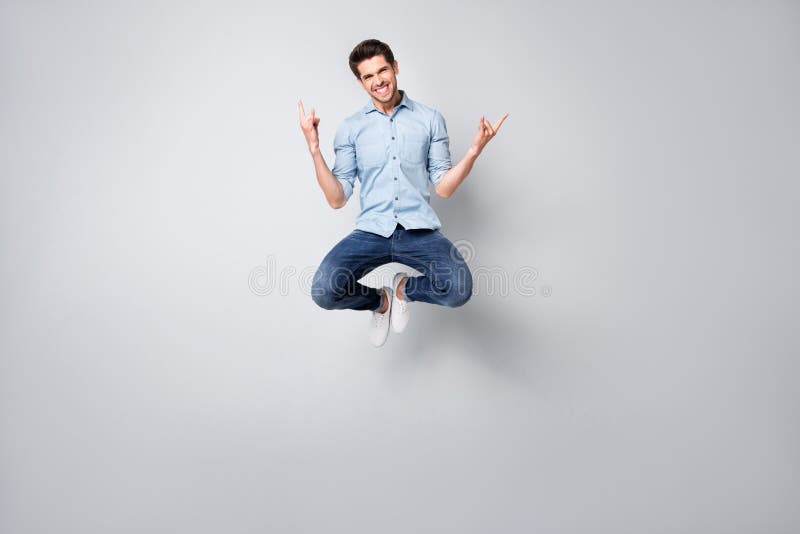 Full length body size photo of cheerful positive trendy ecstatic overjoyed rock fan showing you rock horned fingers