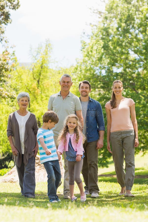Full length of family walking in park royalty free stock images Full length of family walking in park royalty free stock images