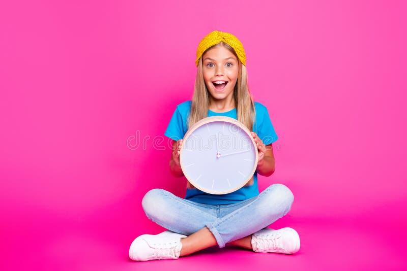 3...2...1.... Full length photo of amazed funky kid hold clock wait for her birthday scream wow omg wear lifestyle blue