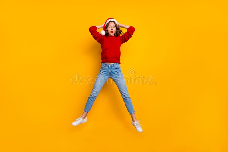 Full length photo of funky lady jumping high to see shock news wear knitted sweater isolated yellow background royalty free stock images Full length photo of funky lady jumping high to see shock news wear knitted sweater isolated yellow background royalty free stock images