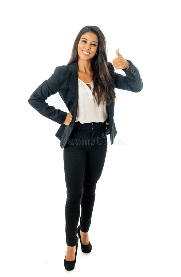 Full length portrait of Attractive latin corporate latin woman looking excited and making thumb up sign in Creative success and royalty free stock image Full length portrait of Attractive latin corporate latin woman looking excited and making thumb up sign in Creative success and royalty free stock image