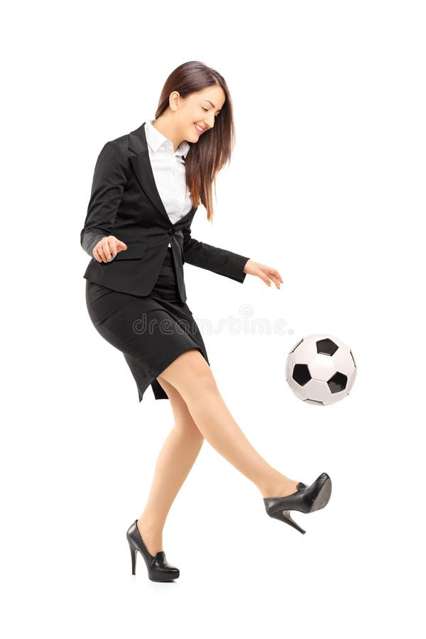 Full length portrait of a businesswoman in high heels kicking a