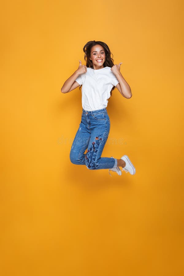 Full length portrait of a cheerful girl with long dark hair