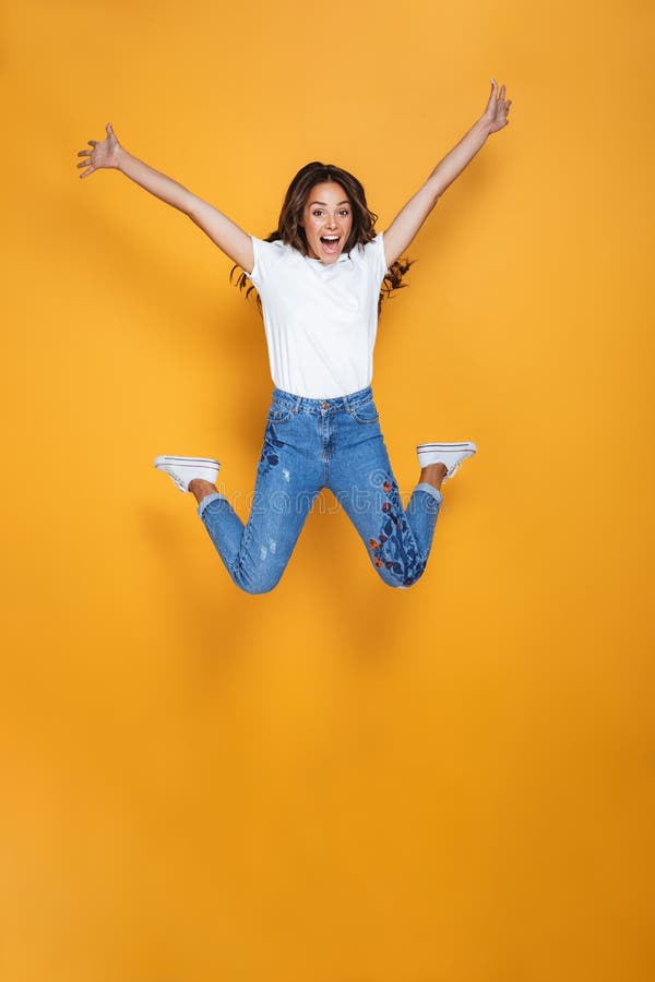 Full length portrait of a cheerful girl with long dark hair