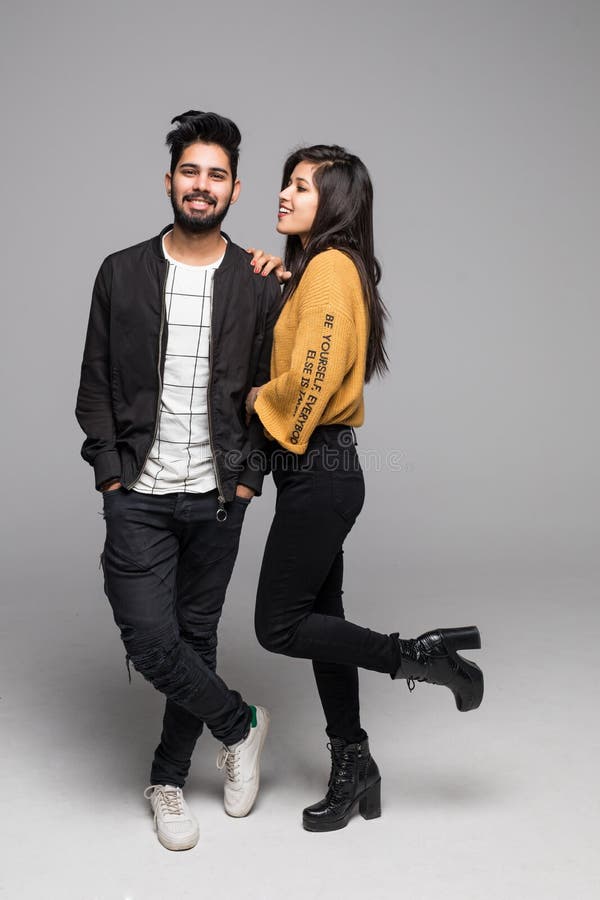 Casual young couple standing and posing Stock Photo | Adobe Stock