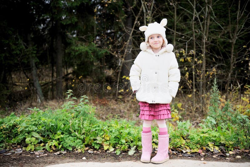 Full length portrait of a child girl in warm hat