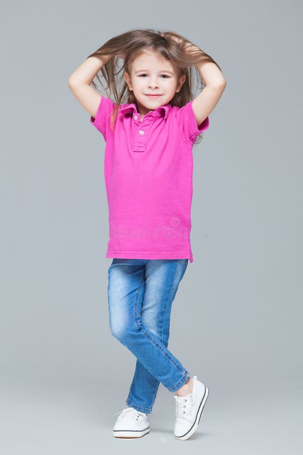 Portrait of Funny Active Little Girl Wearing Casual Clothes: Jeans and ...