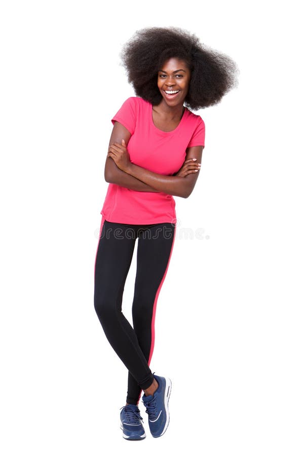 Happy young black sports woman standing against isolated white background royalty free stock photography Happy young black sports woman standing against isolated white background royalty free stock photography