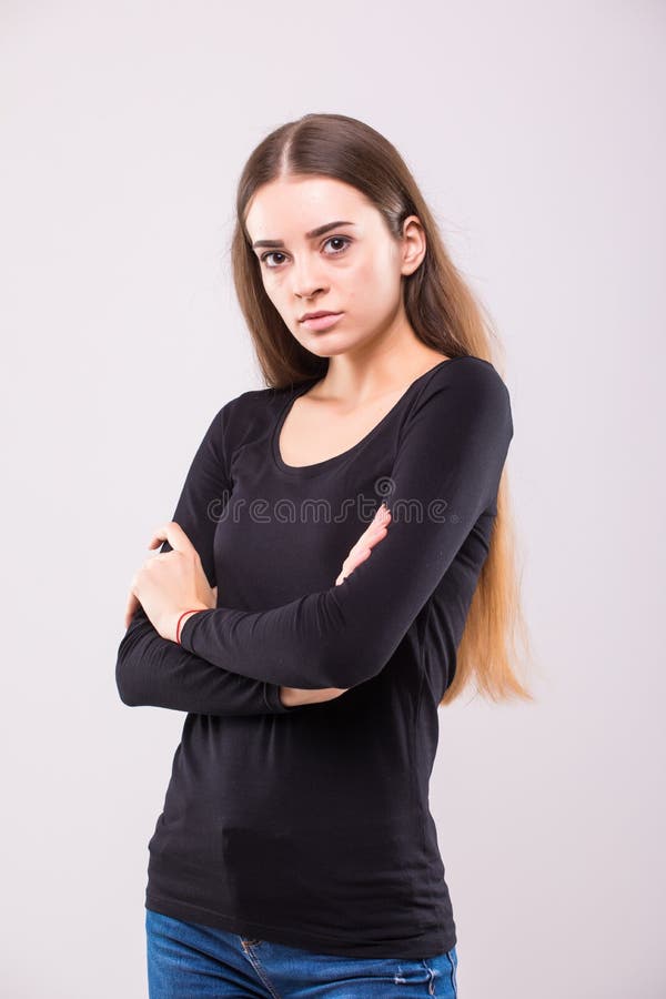 Full length portrait of a happy young woman standing isolated on a white background. Looking at camera stock photos Full length portrait of a happy young woman standing isolated on a white background. Looking at camera stock photos