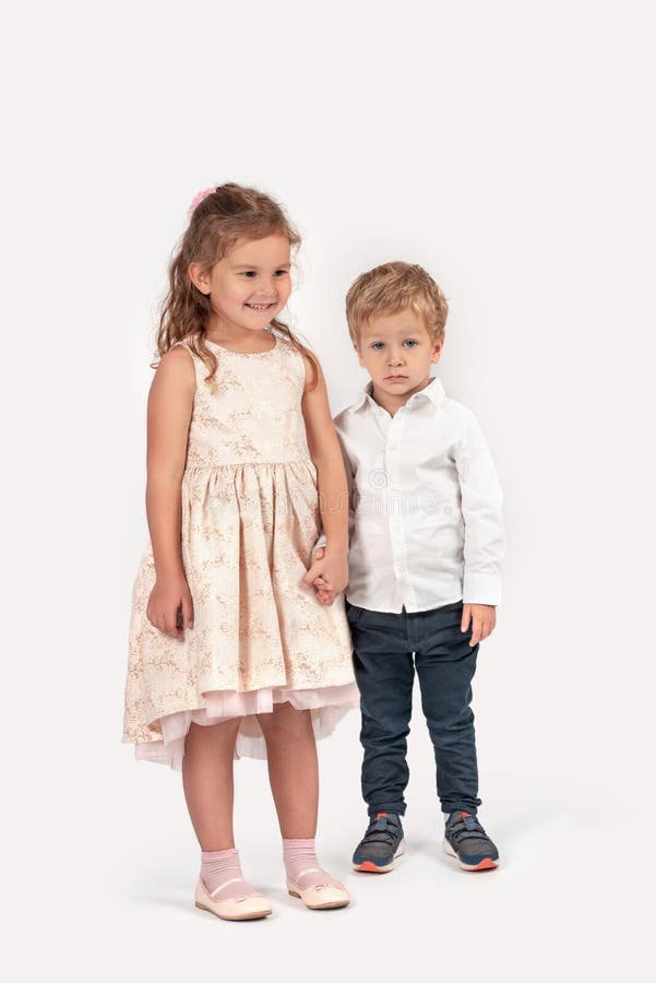 Full Length Portrait of a Little Smiling Girl and Boy Wearing Stock ...