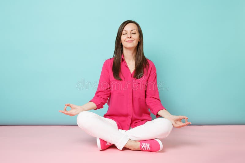 A woman sitting in a yoga pose with a candle in the background Image &  Design ID 0000133281 - SmileTemplates.com