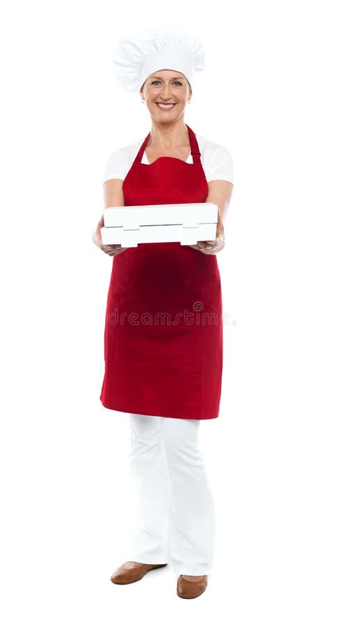 Full length portrait of woman chef offering pizza stock photo Full length portrait of woman chef offering pizza stock photo
