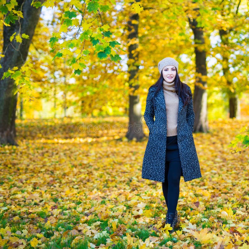 Full length portrait of young woman in autumn park royalty free stock images Full length portrait of young woman in autumn park royalty free stock images