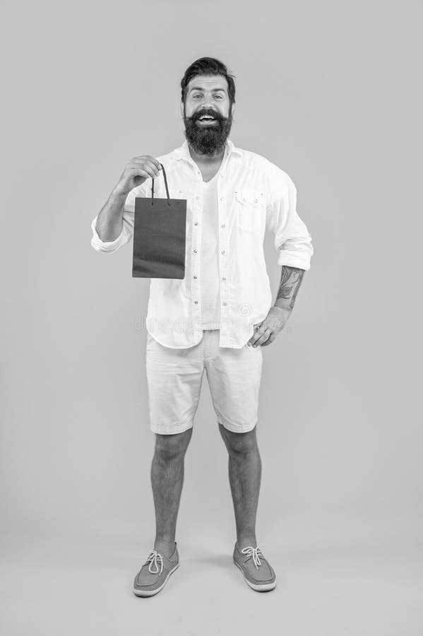 Full length of shopper man at shopping isolated on yellow. shopper man at shopping in studio stock photos