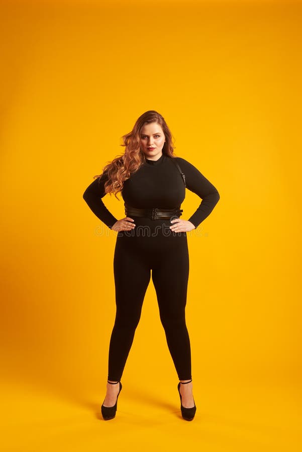 Curvy Girl in Tight-fitting Clothes Posing with Her Hands on Hip Stock  Image - Image of hair, trousers: 117198729