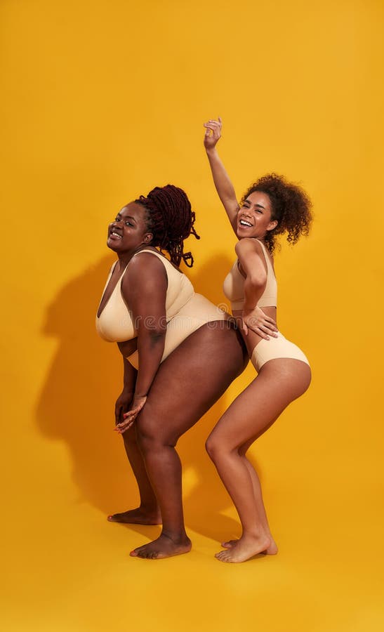 https://thumbs.dreamstime.com/b/full-length-shot-two-funny-slim-plus-size-african-american-women-beige-underwear-looking-joyful-posing-full-length-217398149.jpg