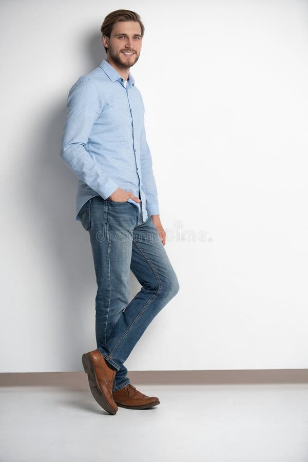 Full length studio portrait of casual young man in jeans and shirt. Isolated on white background. royalty free stock image Full length studio portrait of casual young man in jeans and shirt. Isolated on white background. royalty free stock image