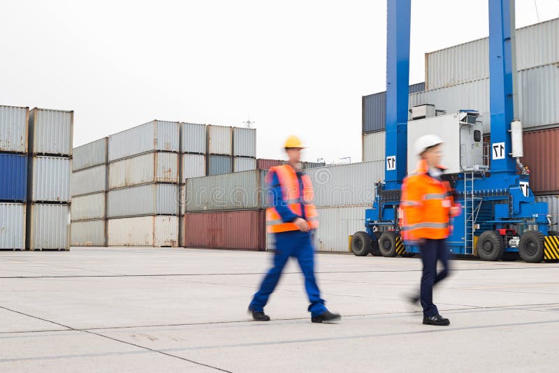 Fulllength of Workers Walking in Shipping Yard Stock Photo Image of