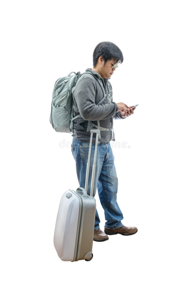 Full length of young traveler using smartphone royalty free stock photography