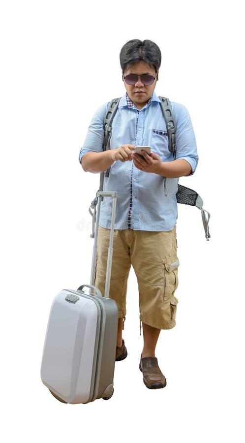 Full length of young traveler using smartphone royalty free stock photography