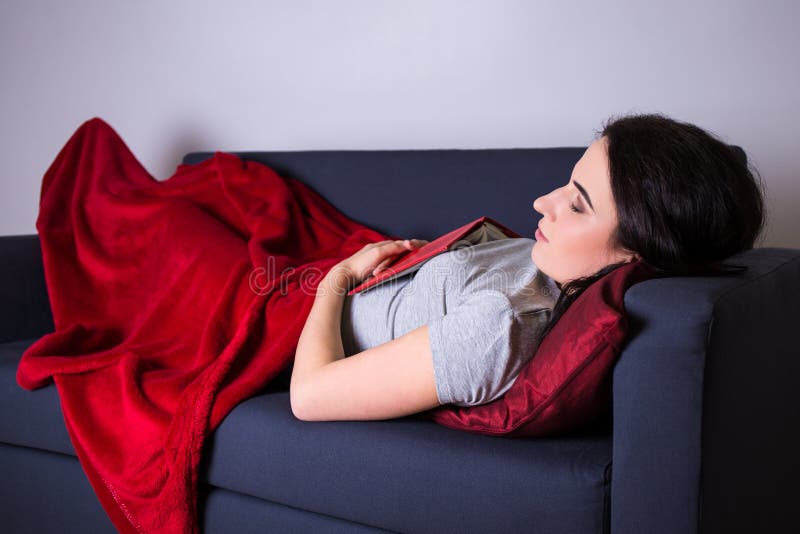 Full Length Of Young Woman Sleeping On Sofa At Home Stock Image Image