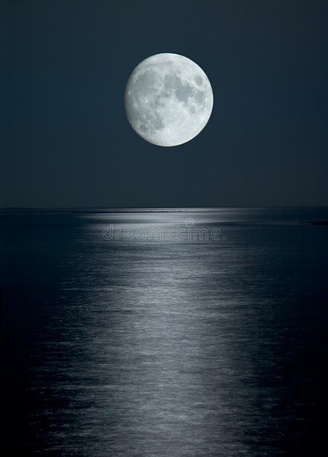 Full moon in black sky stock image