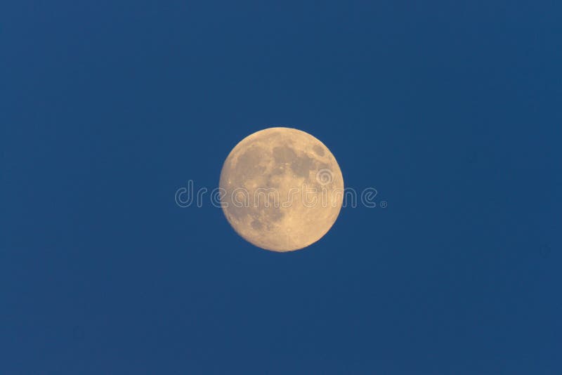 Full Moon in daylight sky