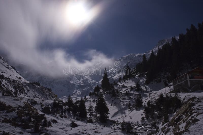 Winter landscape with full moon over the Fagaras Mountains in Romanian Carpathians. Winter landscape with full moon over the Fagaras Mountains in Romanian Carpathians