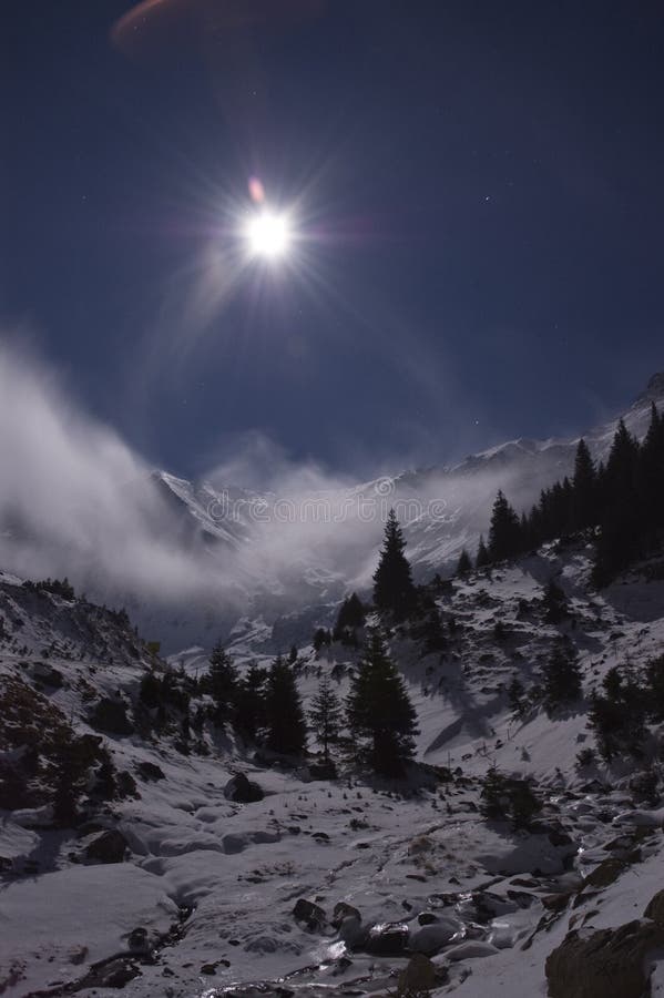 Winter landscape with full moon over the Fagaras Mountains in Romanian Carpathians. Winter landscape with full moon over the Fagaras Mountains in Romanian Carpathians
