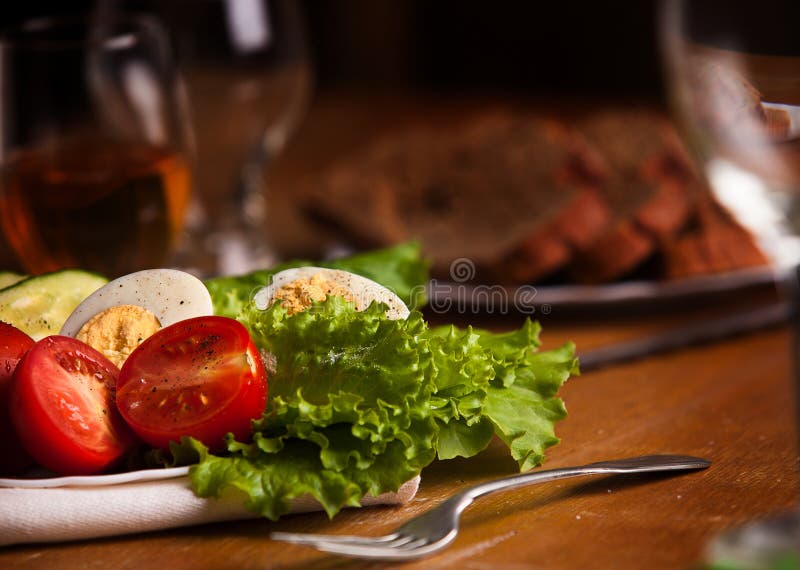 Full Plate of Fresh Salad with Tomato, Cucumbers, Eggs, Lettuce Stock