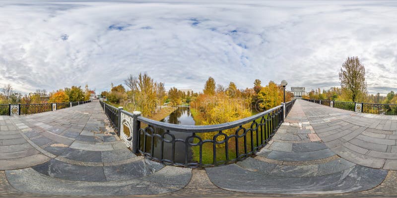 Full seamless spherical cube panorama 360 degrees angle view on pedestrian bridge across small river in autumn city park in royalty free stock photos Full seamless spherical cube panorama 360 degrees angle view on pedestrian bridge across small river in autumn city park in royalty free stock photos