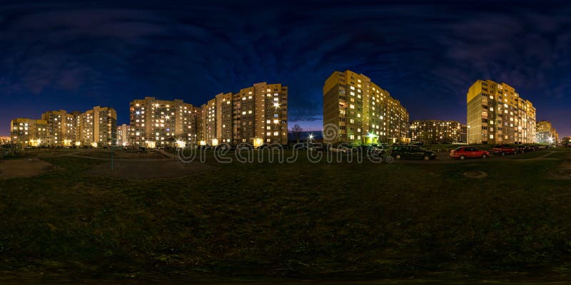 Full seamless spherical hdri night panorama 360 degrees angle view light in windows of multistory building area of urban development residential quarter in equirectangular projection, AR VR content