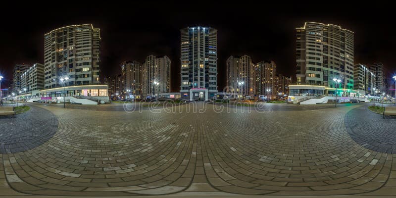 Full seamless spherical hdri night panorama 360 near skyscraper multistory buildings of residential quarter with light in windows in equirectangular projection