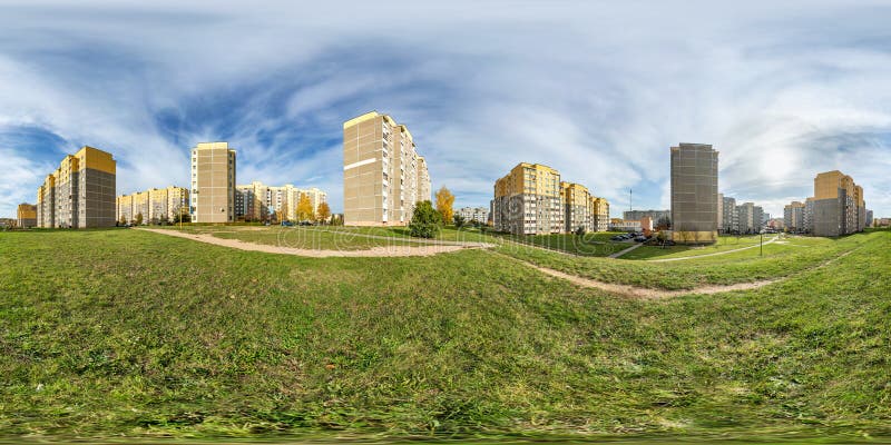 Full seamless spherical hdri panorama 360 degrees angle view light in windows of multistory building area of urban development residential quarter in equirectangular projection, AR VR content