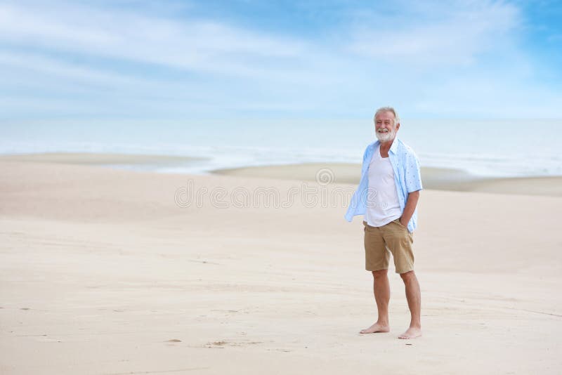 Full Shot Image of Older Caucasian Men, White Beard and White Hair in White and Blue Shirt is Resting and Standing on Sandy Beach Stock Image - Image of pensioner, nature: 193771577 Full Shot Image of Older Caucasian Men, White Beard and White Hair in White and Blue Shirt is Resting and Standing on Sandy Beach Stock Image - Image of pensioner, nature: 193771577