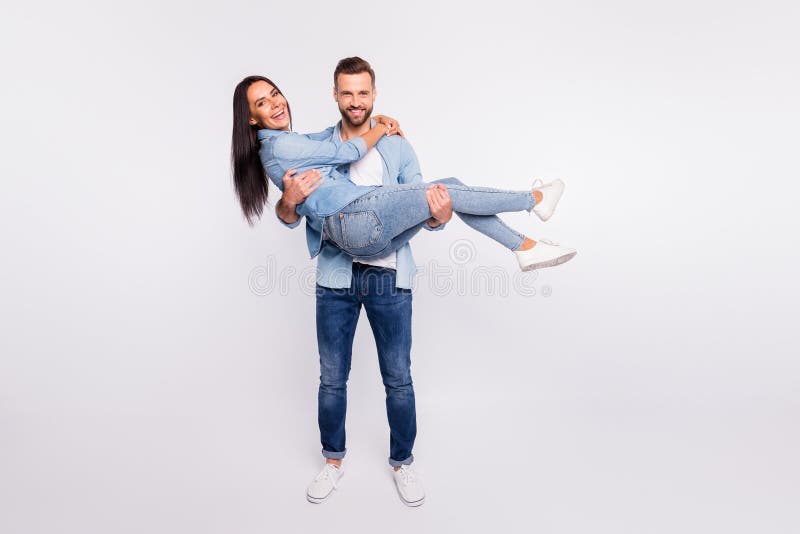 Full size photo of cheerful spouses cuddling smiling laughing wearing denim jeans shirt isolated over white background