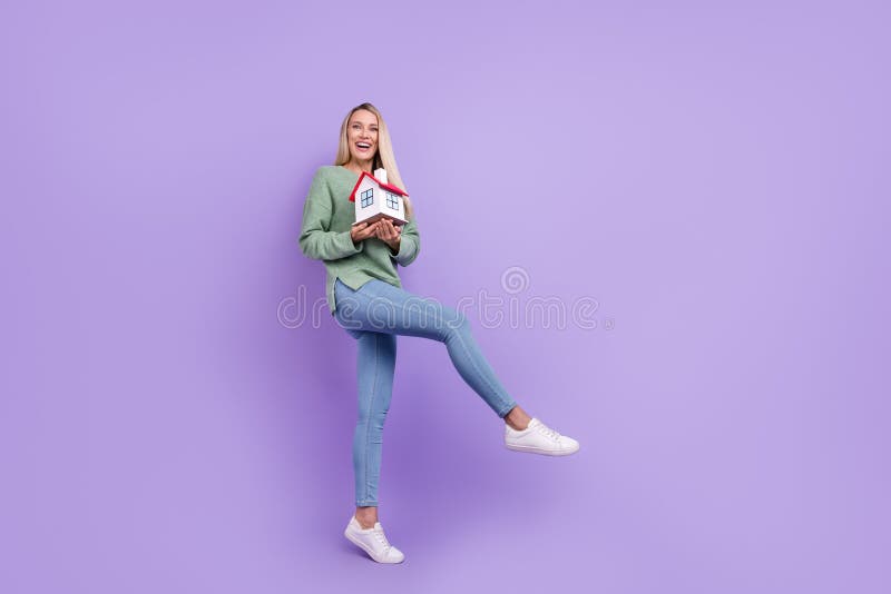 Full size profile side photo of young girl new home rejoice relocation isolated over violet color background.