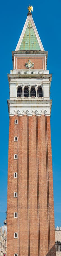 Full size view of Campanile Bell Tower at San Marco square in Venice, Italy, at sunny day and deep blue sky