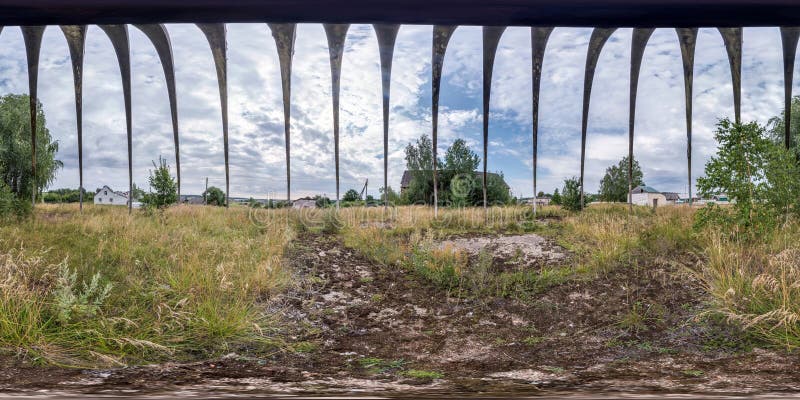 Full spherical seamless hdri panorama 360 degrees angle view inside metal frame of an old abandoned barn in equirectangular royalty free stock image.