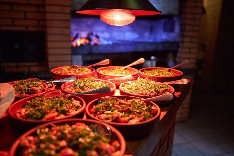 Full Table with Various Dishes in a Restaurant or Cafe Stock Photo