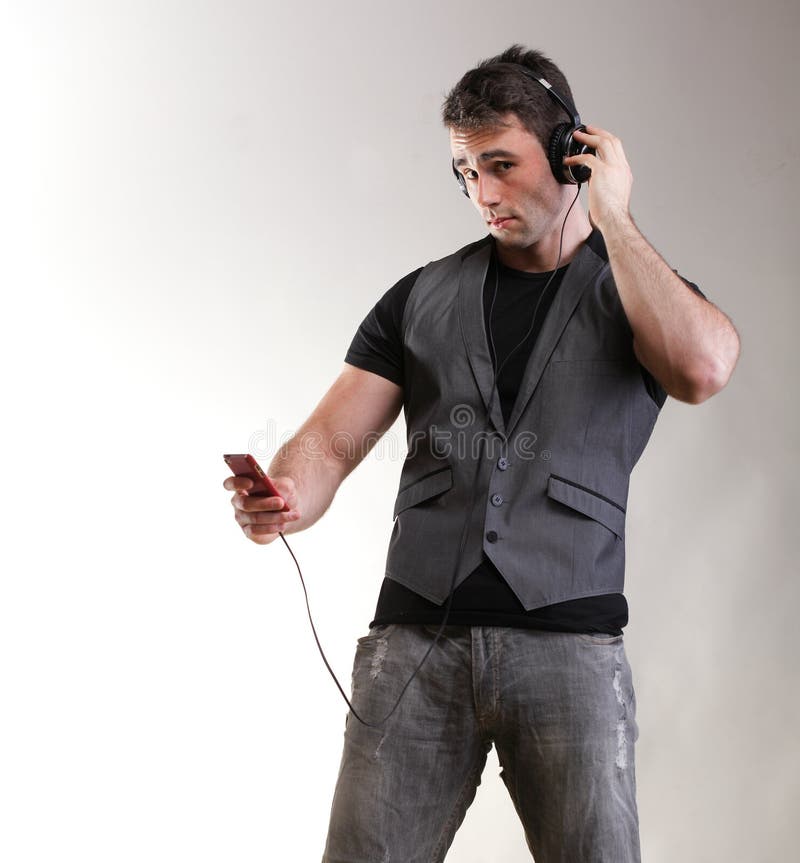 Full telefon för pojke för skola för musik för längdståendeheadphone royaltyfria bilder