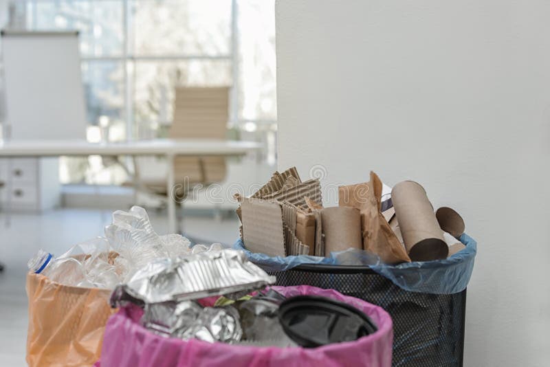 Full Trash Cans in Modern Office, Space for Text. Stock Photo Image