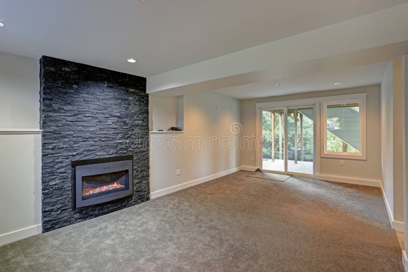 Fully renovated living area with black fireplace royalty free stock images Fully renovated living area with black fireplace royalty free stock images