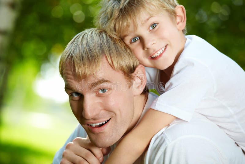 Fun. Daddy carries on a back of small son Fun. Daddy carries on a back of small son